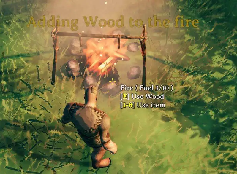 adding wood to the campfire